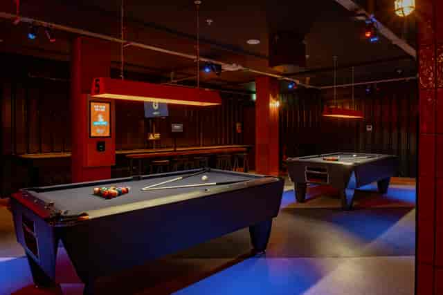 Vibrant game room with billiard tables, perfect for events & networking in London.