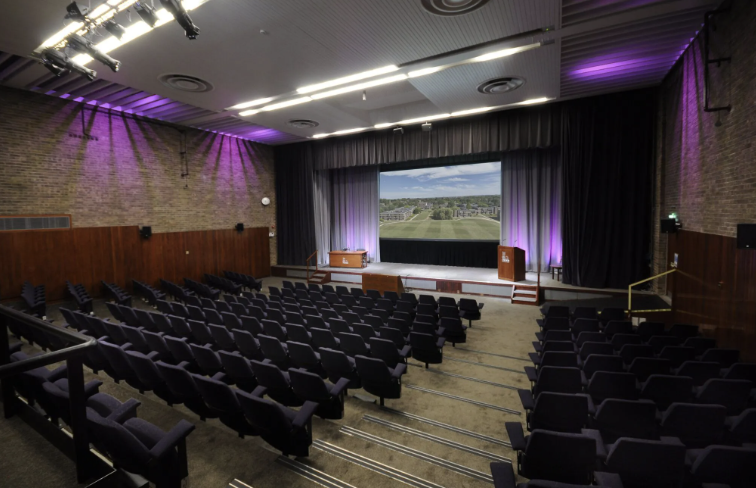 Wolfson Hall at Magdalene College: theater seating for conferences and events. - Banner