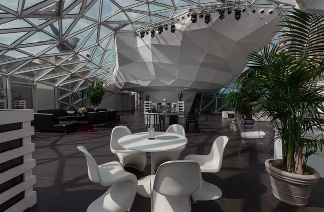 Modern geometric event space in La Lanterna Rome, ideal for corporate gatherings and presentations.