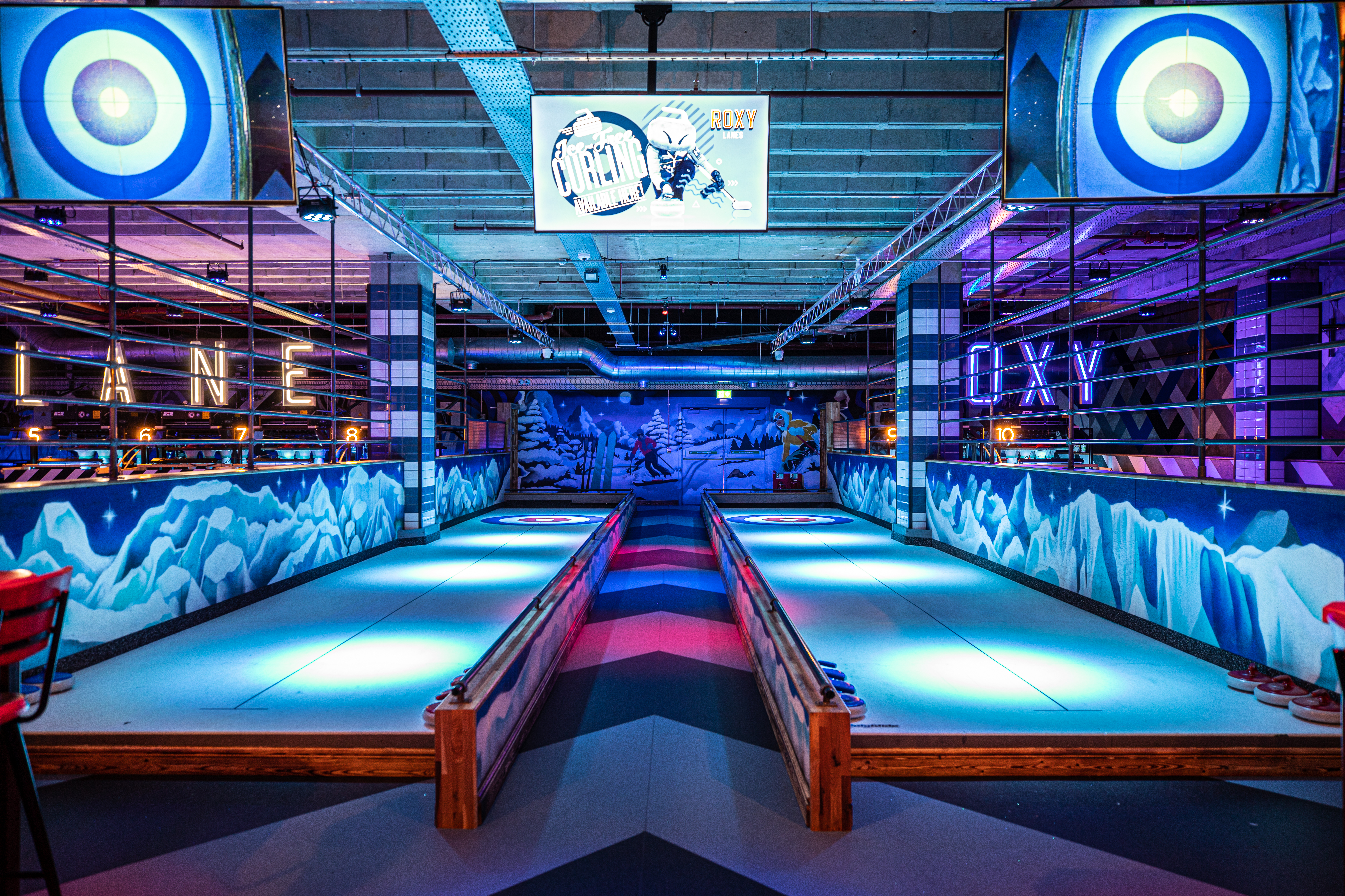 Indoor curling setup at Roxy Lanes, vibrant event space for team-building and networking.