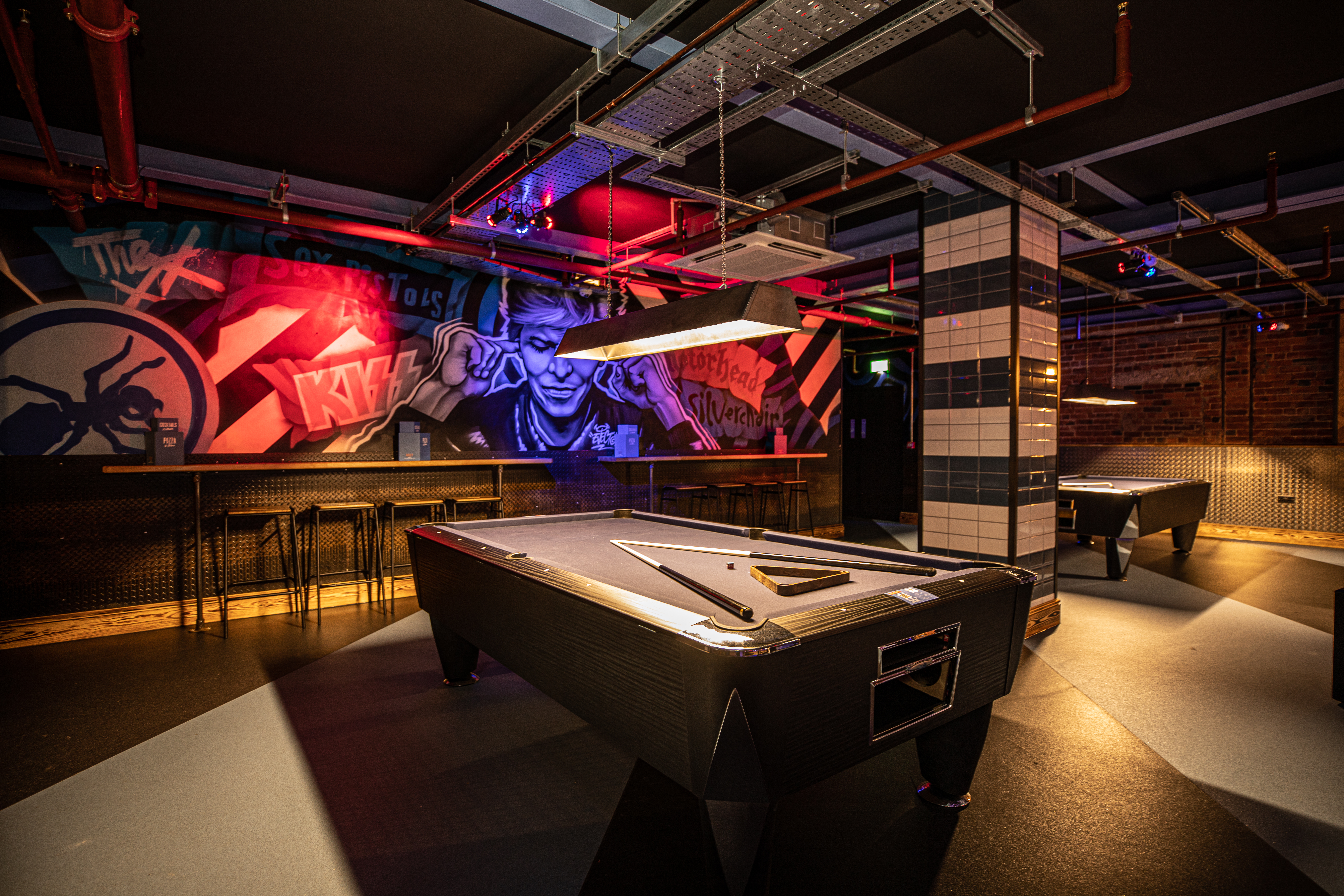 American pool area with stylish tables for networking and team-building events in Leeds.