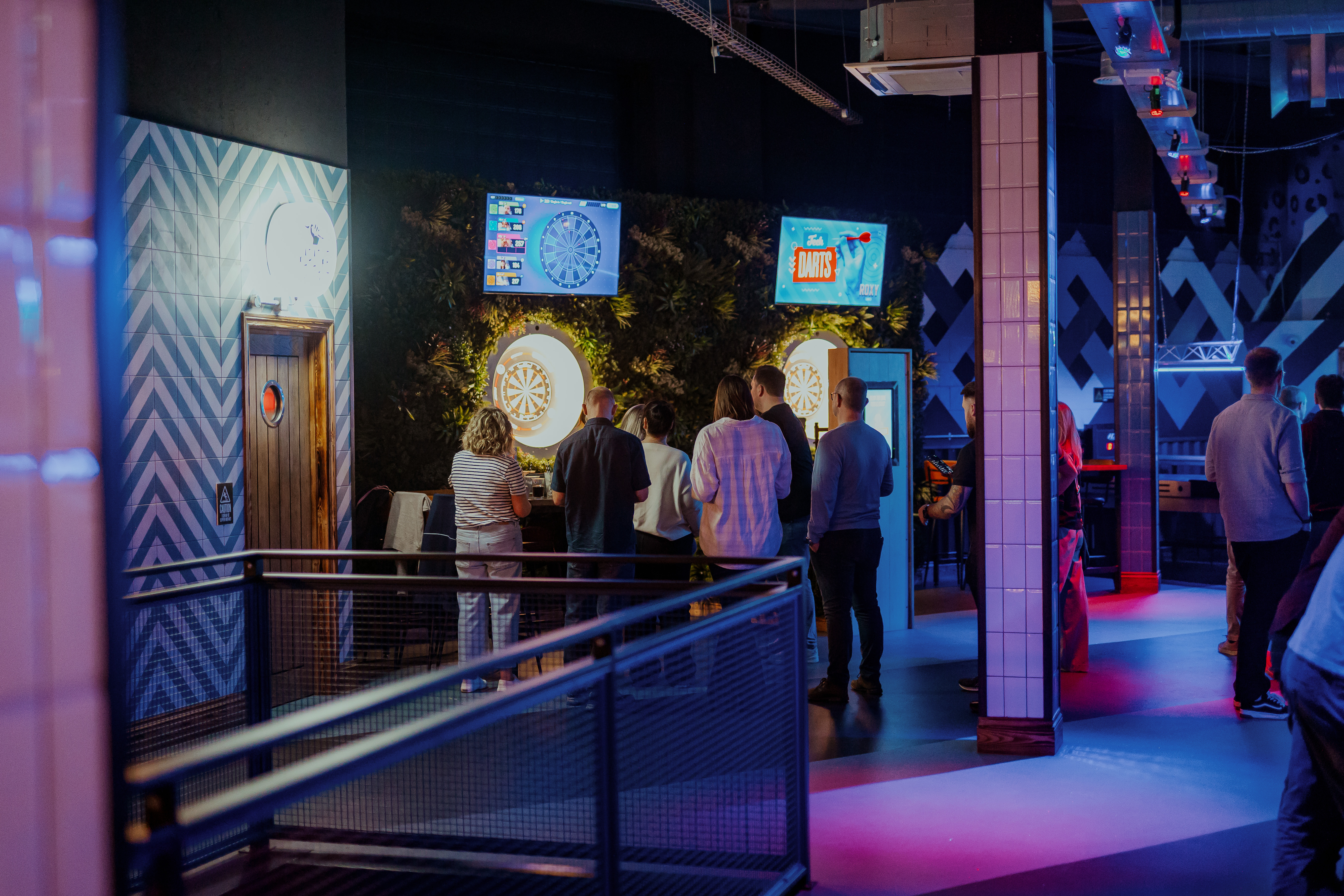 Vibrant event space at Roxy Lanes, Bristol with dart boards for networking and team-building.
