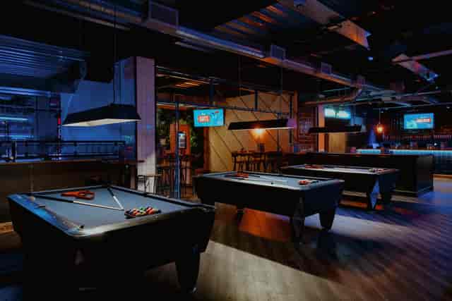 Bullseye Zone at Roxy Lanes Bristol - vibrant event space with pool tables for networking events.