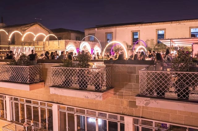 Rooftop event space at 1010 Hall with neon lighting, perfect for evening receptions and social events.