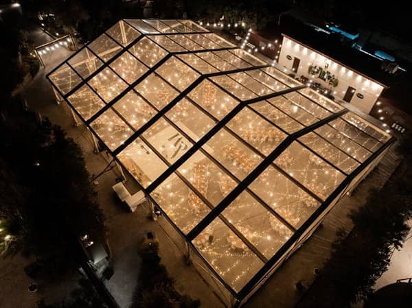 Clear-span marquee tent with fairy lights at Casitas Lapatsa for elegant outdoor wedding events.