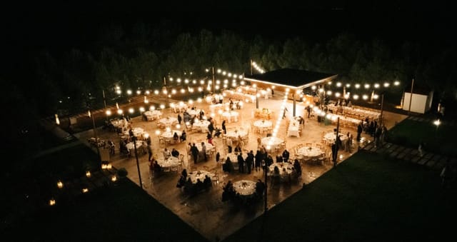 Outdoor wedding venue in Heritage with bistro lighting for evening gala events.