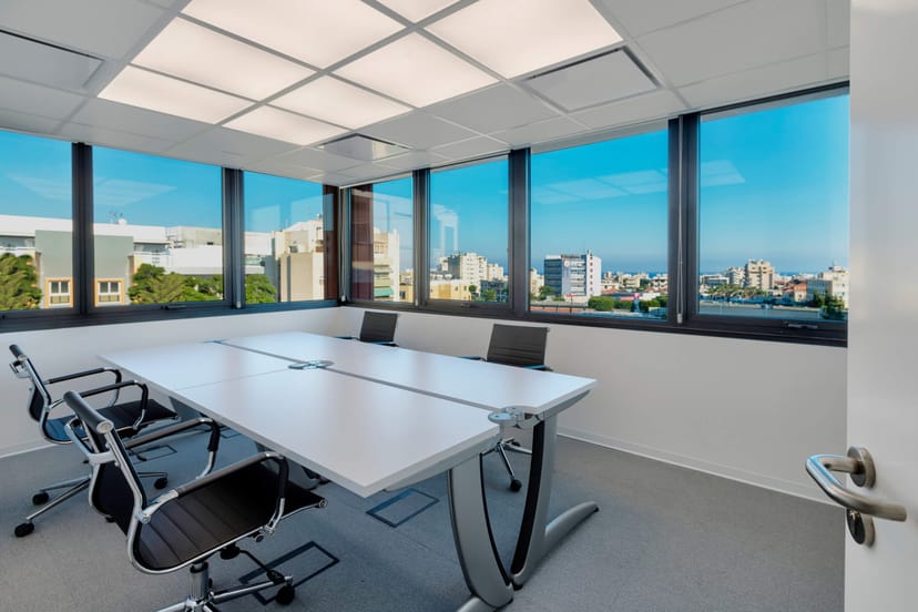 Modern conference room with modular seating for executive strategy sessions and interviews.