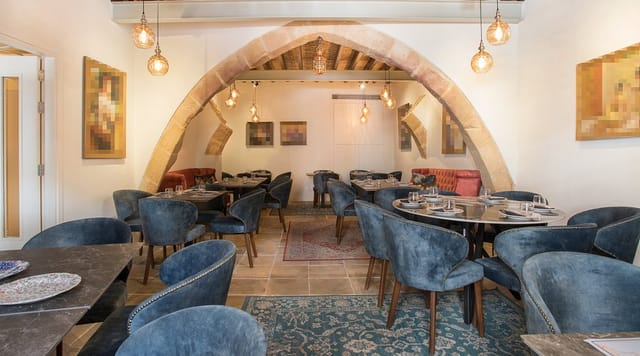 Madama Residence restaurant with arched interior for private dining and high-end networking events.