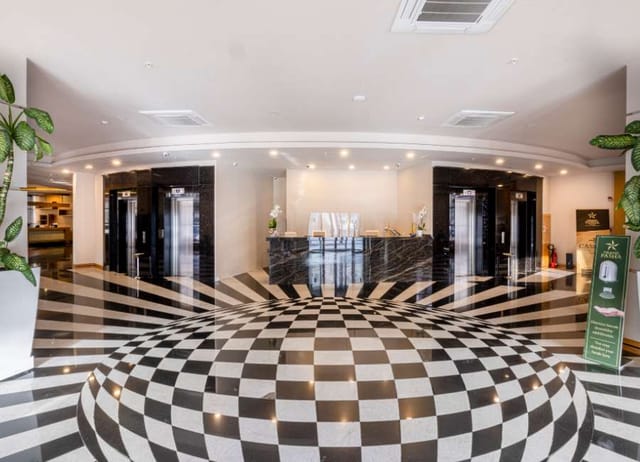 Grand Pasha Lefkosa hotel lobby with high-contrast floors, ideal for event registration and flow.