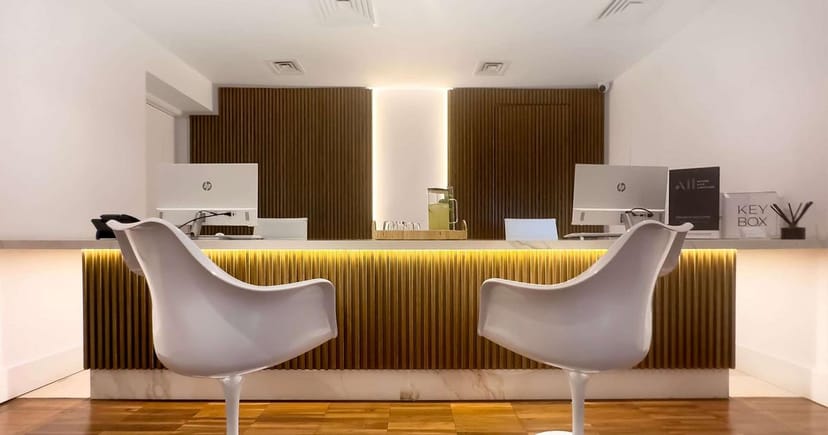 Modern hotel registration desk with fluted wood for VIP event check-in and corporate meetings.