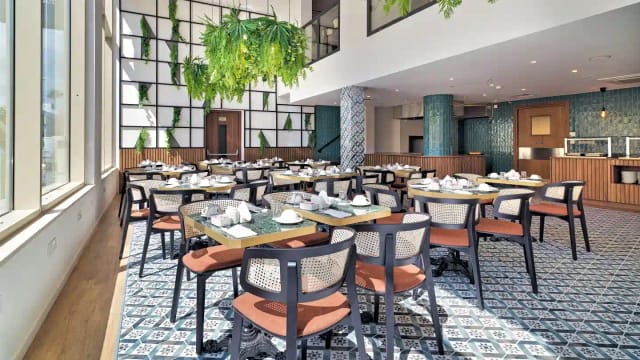 Bright restaurant with biophilic design for networking breakfasts and business events.