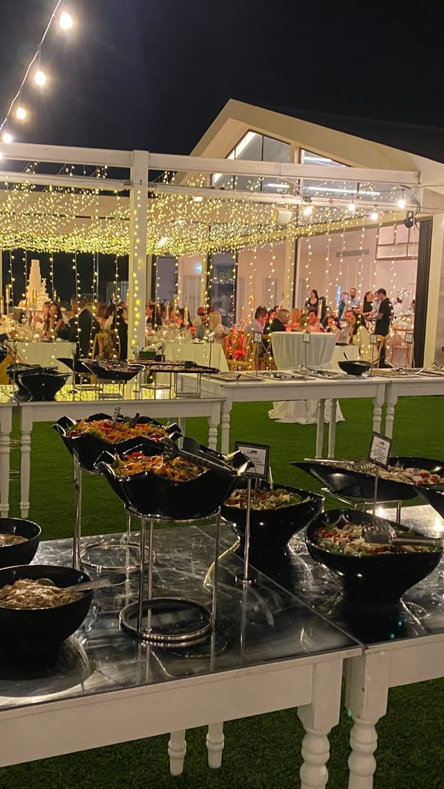 Ampeleon restaurant evening banquet with elegant string lighting for corporate events and weddings.