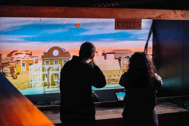 individuals interacting with digital display at King Pins Manchester event zone