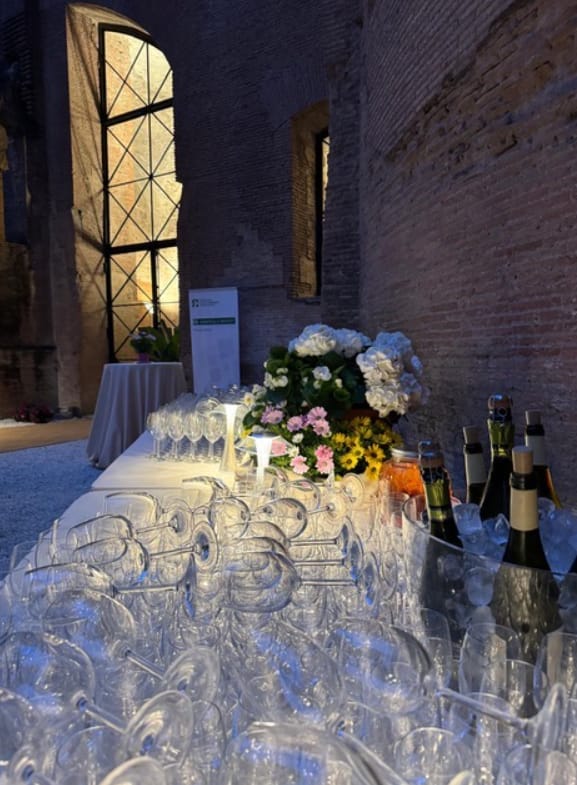 Aula Adrianea welcome reception with floral decor for luxury corporate events and venue hire.