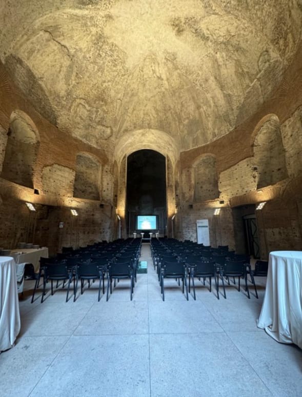 Aula Adrianea historical venue with theater-style seating for corporate events and conferences.
