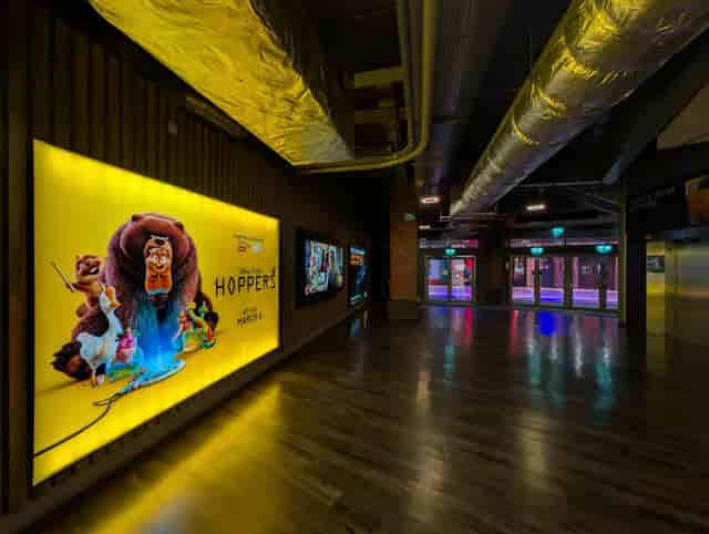 Lux Cinema Screens foyer with illuminated display for networking and corporate events.