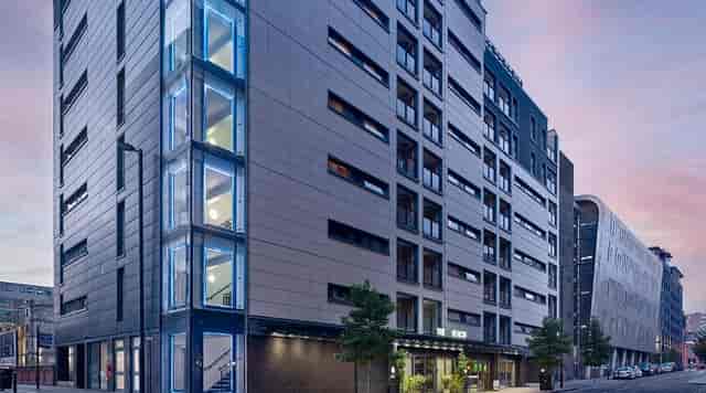 Modern event venue with glass architecture in Manchester for meetings and gatherings.