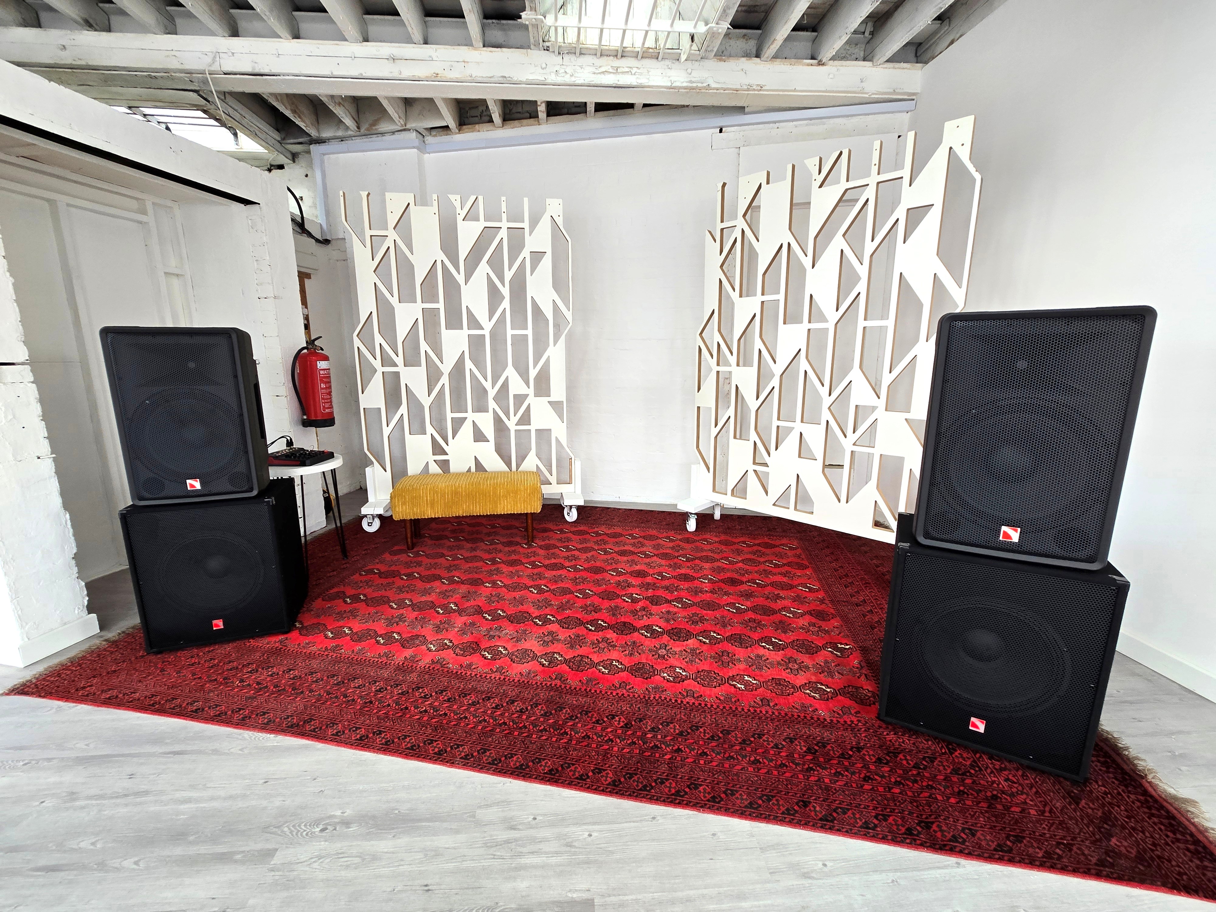Stokey Hall event setup with sound speakers, ideal for presentations and gatherings. - Banner