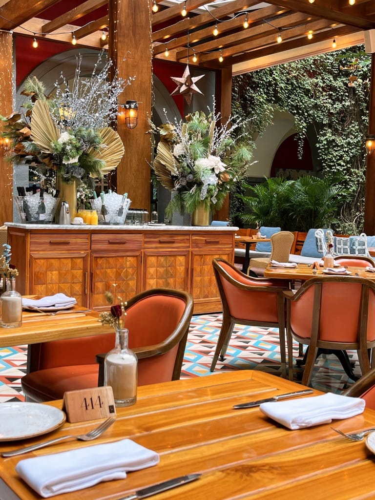Upscale mid-century modern restaurant dining room for corporate networking reception.