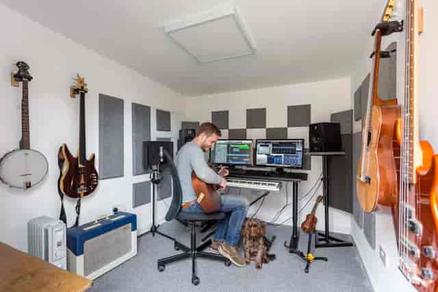 Sound-proof music recording booth in creative studio for professional audio production rental.