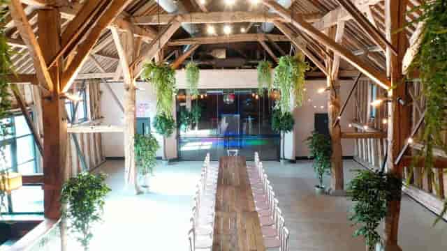 Rustic-chic barn wedding venue with vaulted timber, ideal for corporate dinners and banquets.