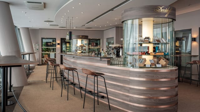 Davidoff Lounge at Allianz Arena: Upscale curved bar for premium B2B networking and conferences.