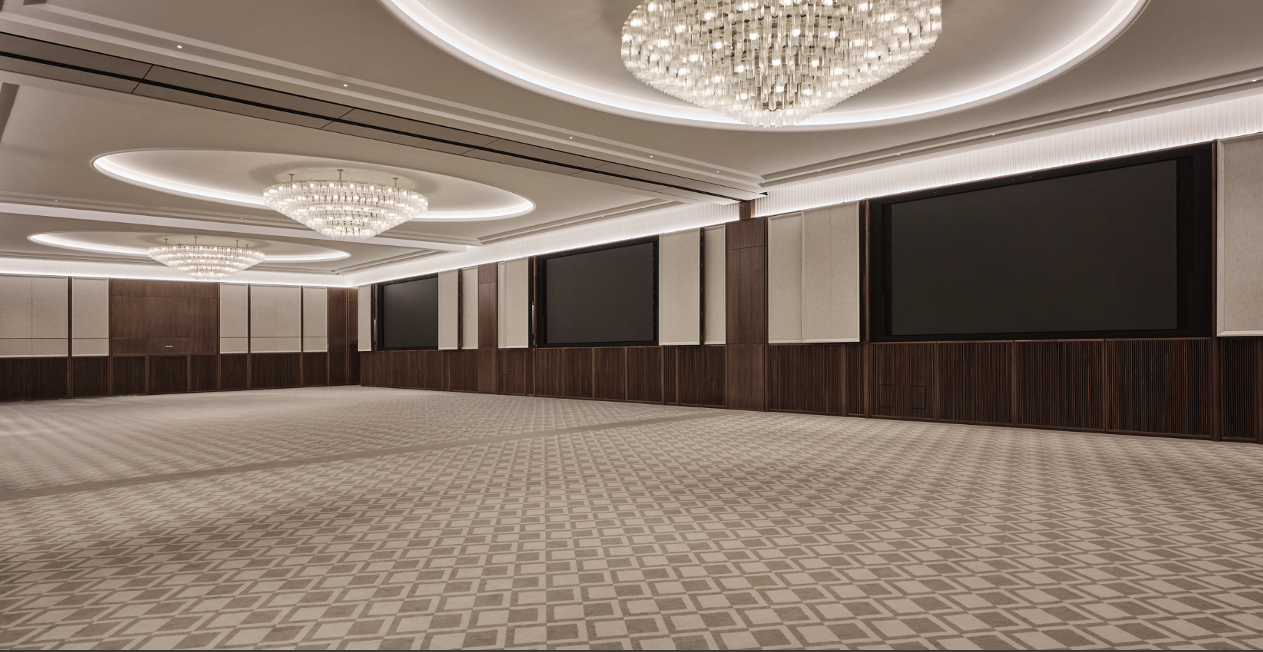 Elegant Grand Ballroom with modern chandeliers for corporate events and receptions. - Banner