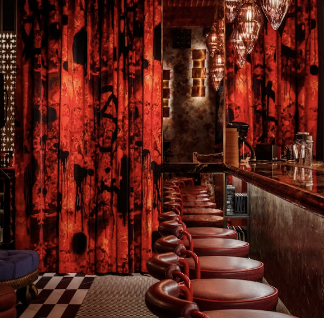 Chateau Denmark bar with red curtains, perfect for cocktail receptions and networking events.