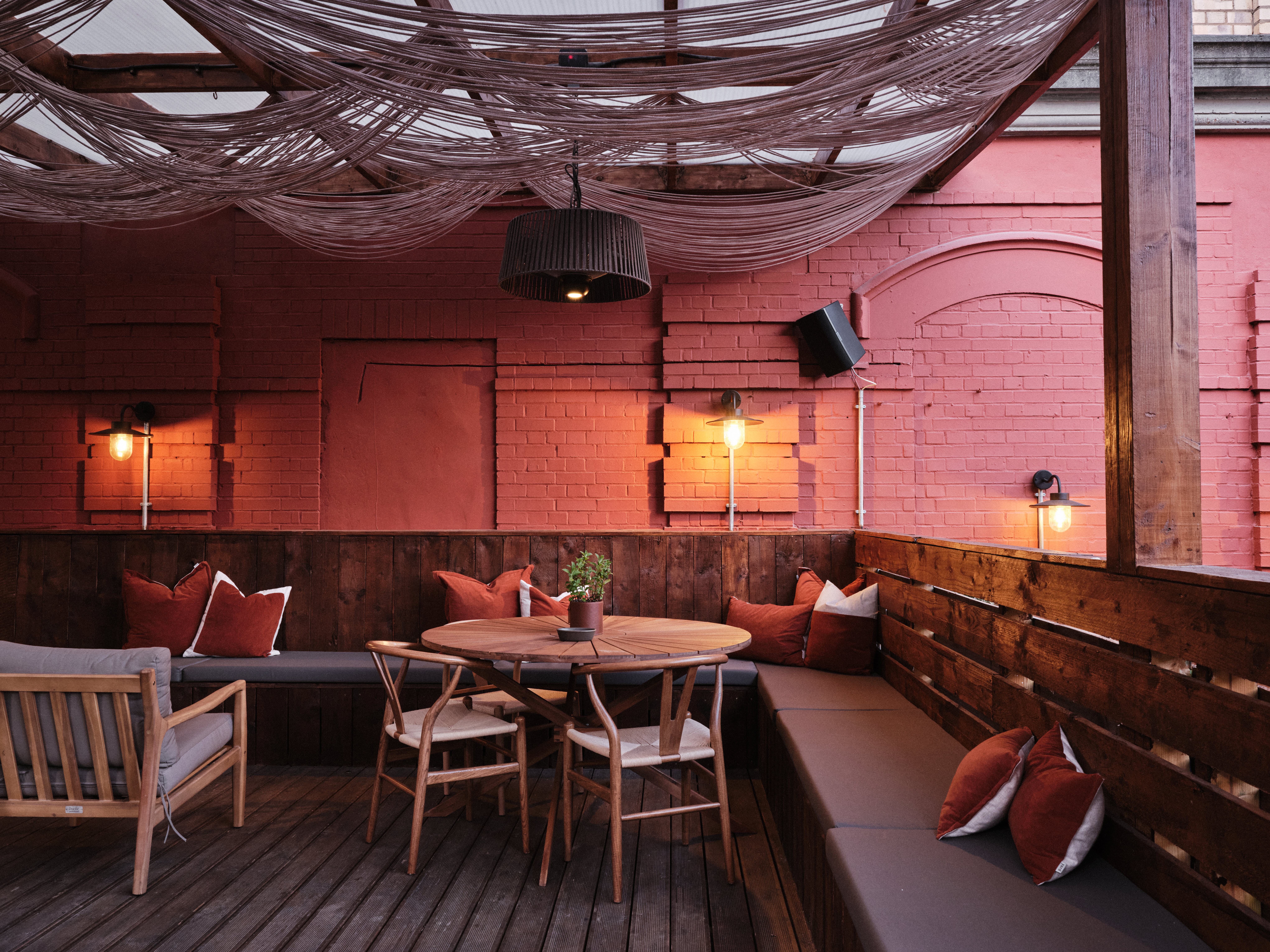 "Stylish outdoor event space at Pyro Hut with warm lighting for intimate gatherings" - Banner