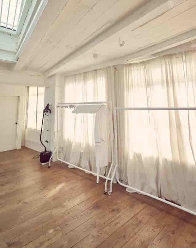 Bright studio space with large windows, ideal for fashion events and workshops.
