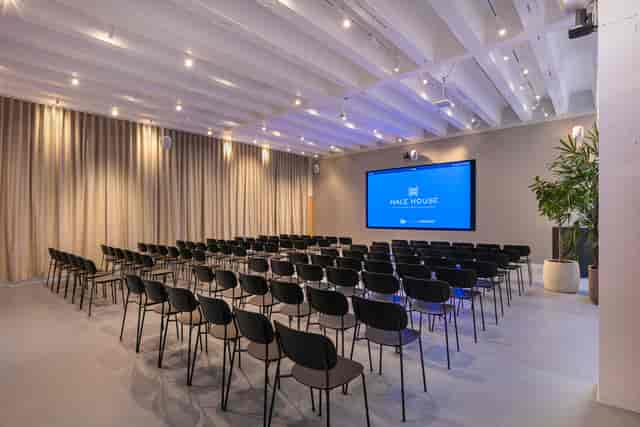 The Events Lounge at Hale House: modern theater-style breakout room for corporate presentations.