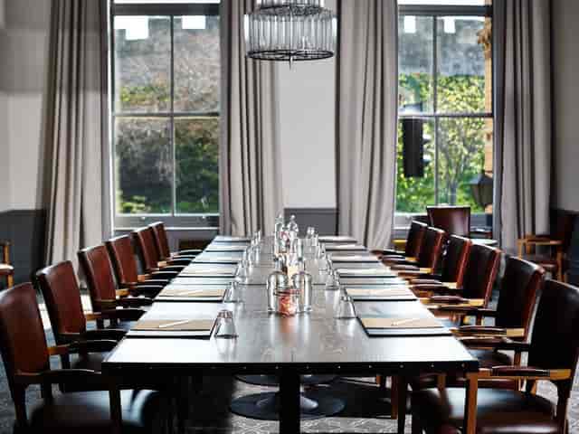 Ebor meeting room with long wooden table for formal gatherings and strategic planning.
