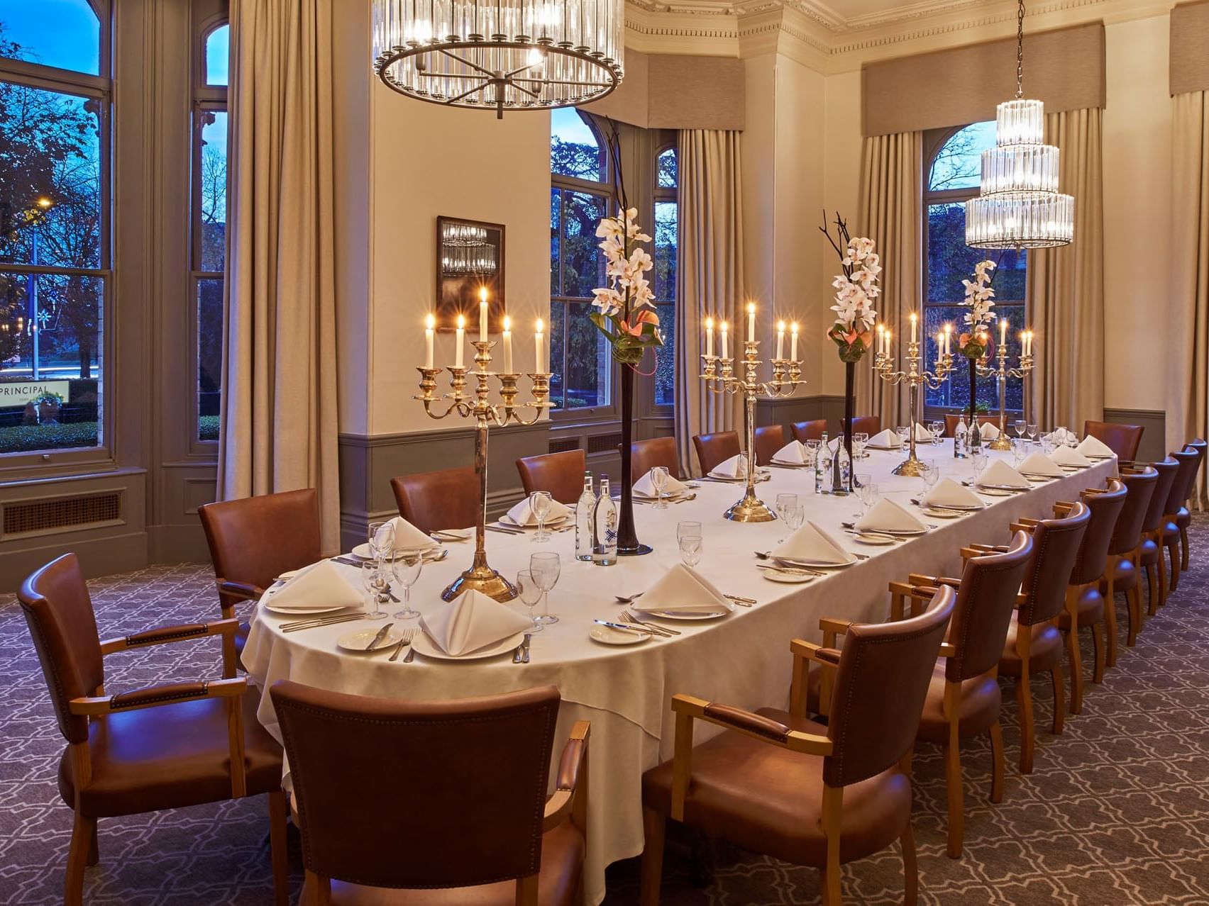 Elegant dining table with white linens for formal gatherings at The Milner York.