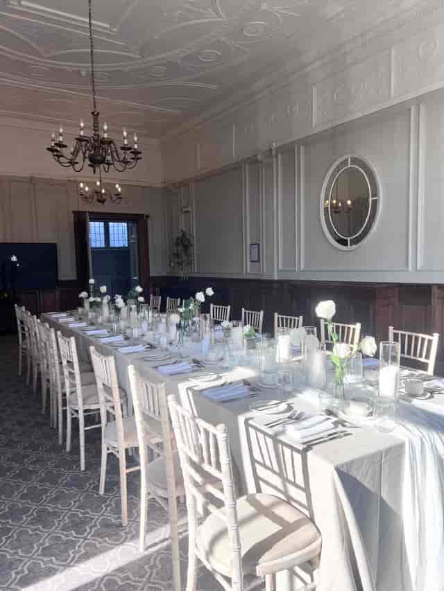 Elegant dining table with white flowers in Wedgewood, The Milner York event space.