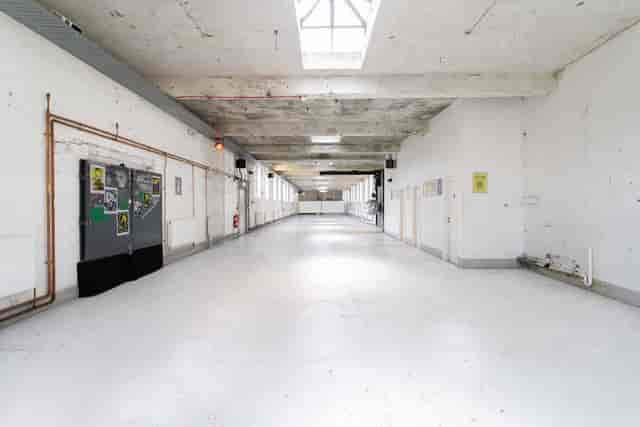 Spacious industrial penthouse venue with high ceilings for events and exhibitions.