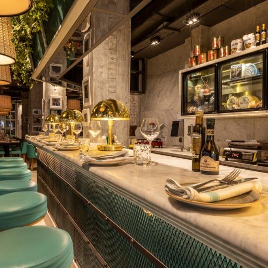 Riva Blu Birmingham bar: upscale marble interior for VIP networking and corporate reception events. - Banner