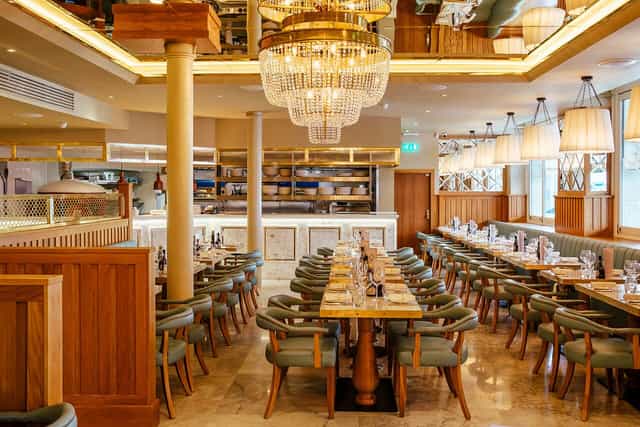 Private dining room in Piccolino Mayfair featuring chandelier lighting for corporate board meetings.