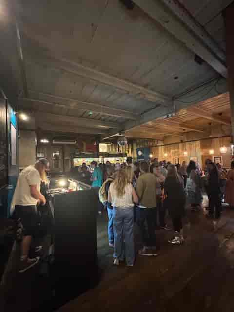 Ground Floor Bar industrial venue with DJ booth for corporate events and social networking mixers.