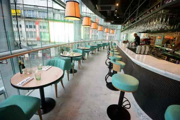 Riva Blu Manchester bar featuring modular seating and city views for networking and mixers.