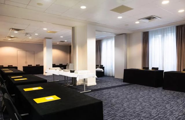 Voltaire conference room at Crowne Plaza Paris: classroom-style meeting space with catering station.