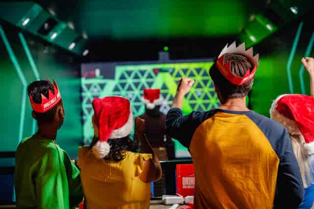 Christmas event at TOCA Social, Birmingham with festive attire and interactive engagement.