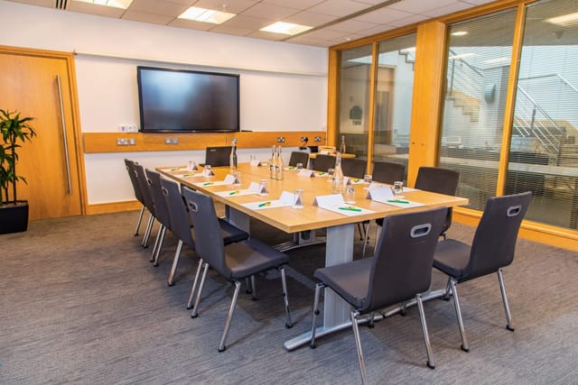 Boardroom at Spaces@321: Ergonomic meeting room setup for corporate collaboration and business events.