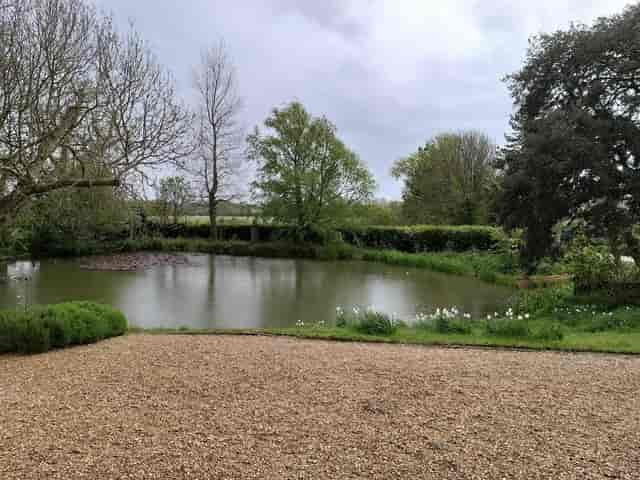 Outdoor event space with pond at Charleston Museum, Firle: ideal wedding and corporate venue.