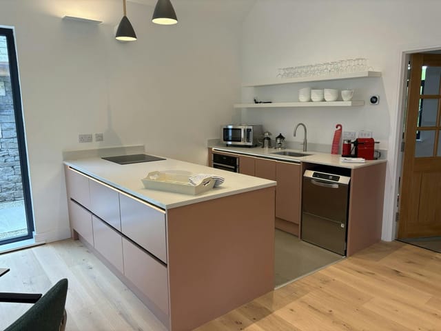 Modern kitchenette in Crosscrake Community Hub, ideal for breakout sessions and event catering.