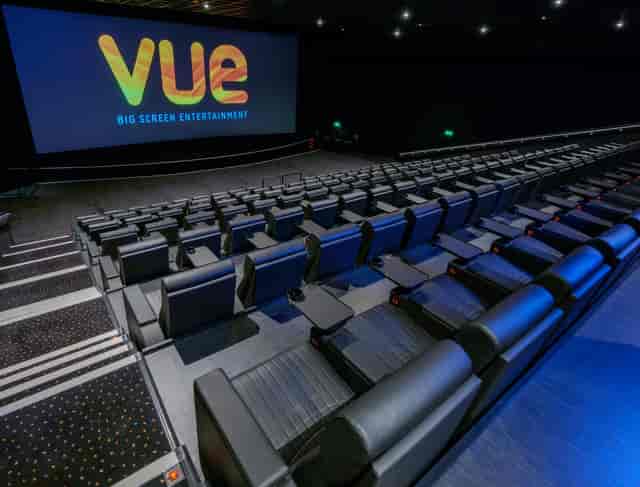 Corporate presentation in Vue Edinburgh cinema auditorium with tiered seating.