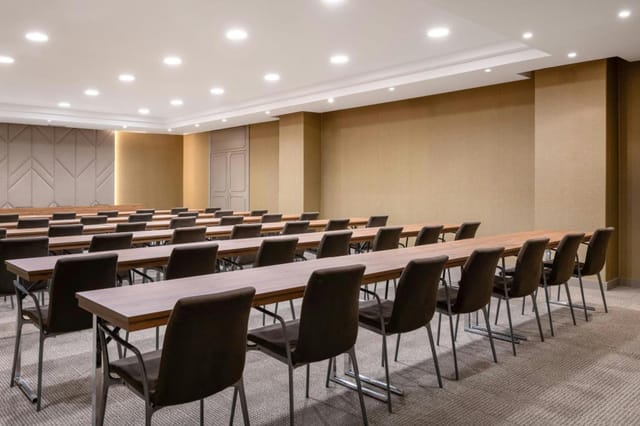 AC Hotel Sevilla conference room, classroom-style setup for training workshops and business events.