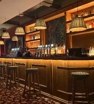 The Bear bar with warm lighting for VIP networking happy hours and corporate reception events.