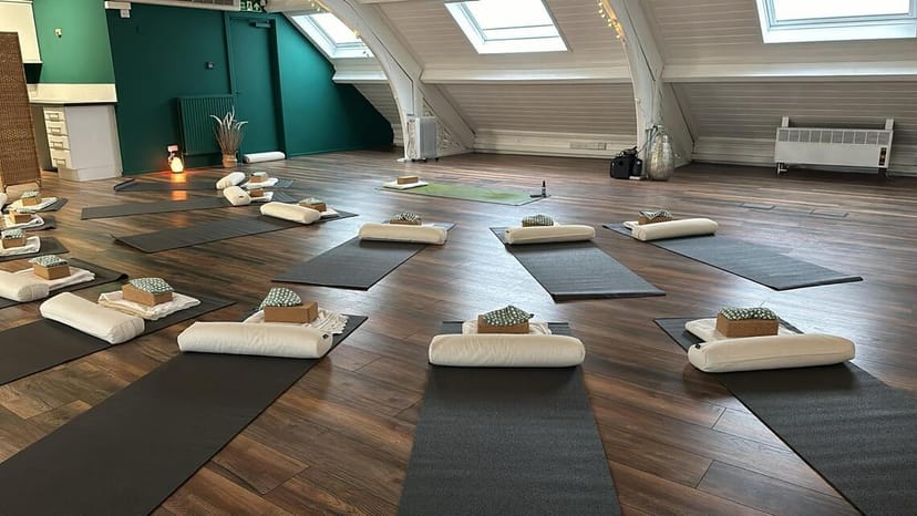 Wellness event space for yoga and mindfulness sessions in a bright attic studio.