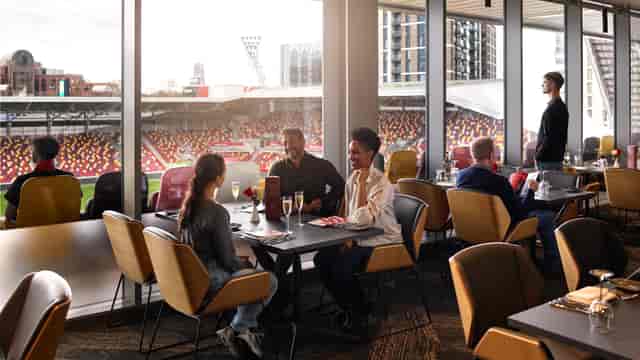 Premium hospitality suite at ANIMA stadium with floor-to-ceiling views for VIP corporate events.