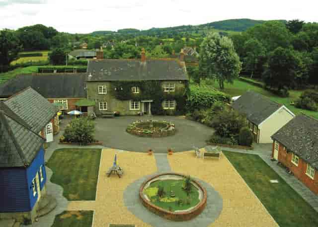 Sun Terrace at The Coppleridge Inn: charming courtyard venue for boutique weddings and retreats.